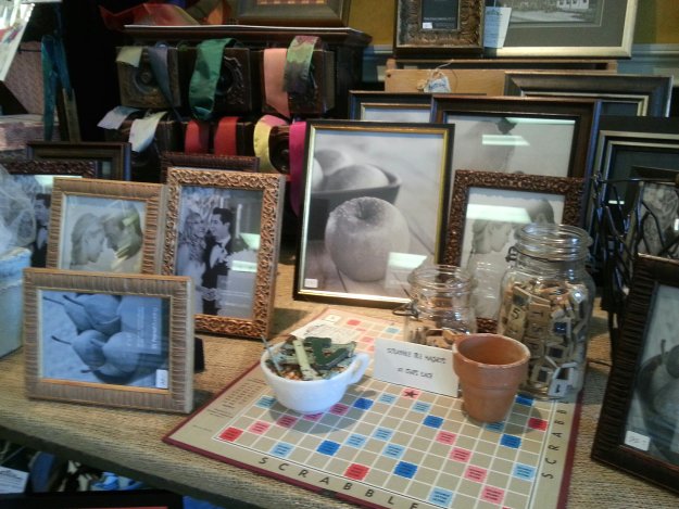 Creative use of supplementary props with photo frames is creatively presented by The Village Framers in Yarmouth ME